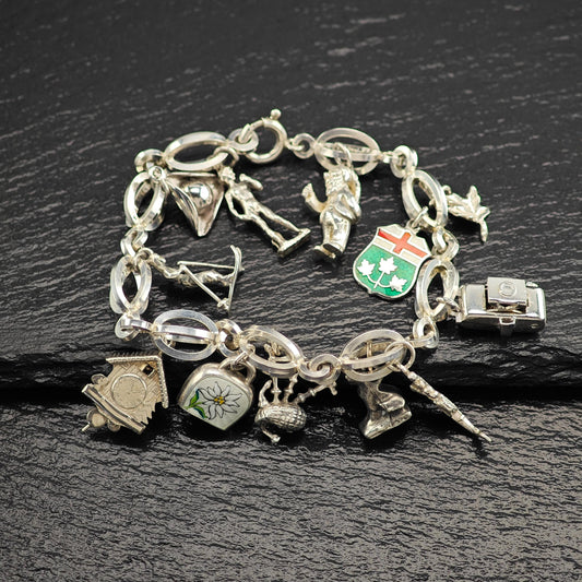 1950's 10 Charm Bracelet 1 Pewter, Enamel, Skier Sterling Silver