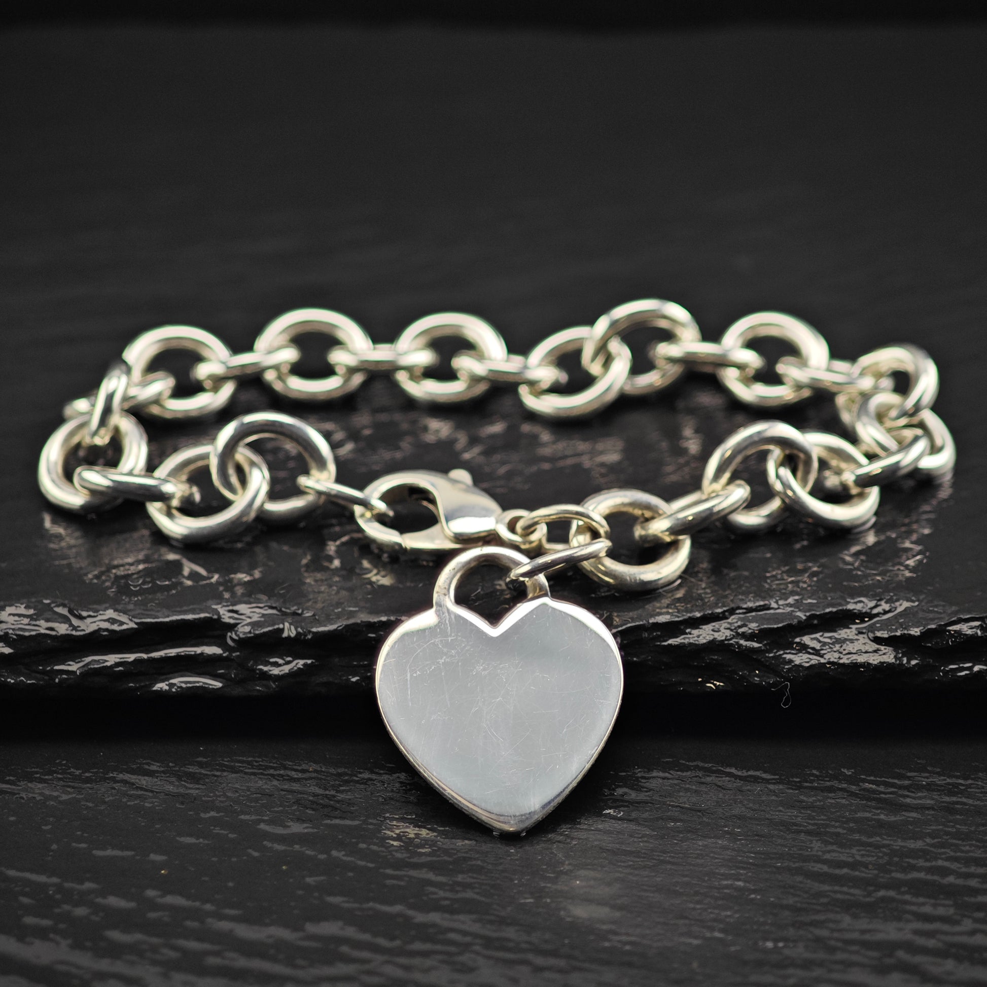 Tiffany Heart charm curb bracelet with a heart-shaped charm
